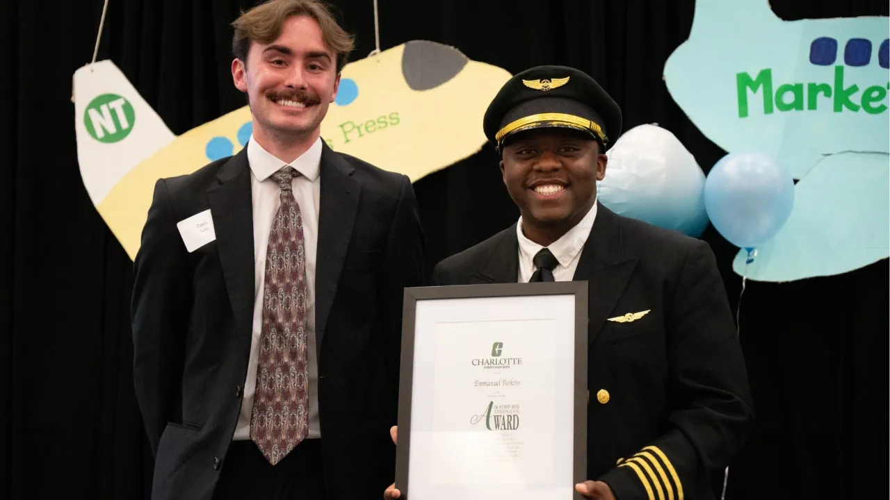 Emmanuel Perkins presented with award by Davis Cuffe