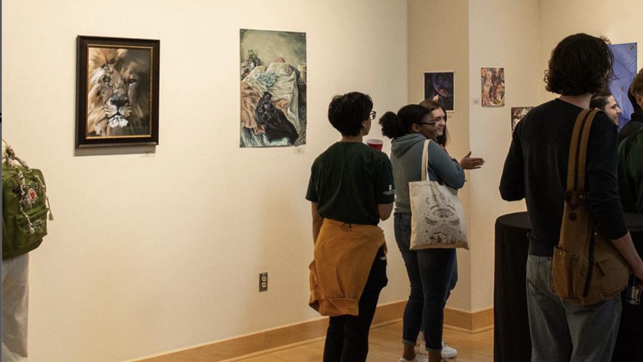 a group of people looking at art