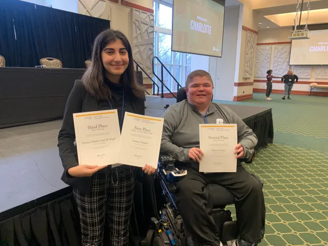 Sunnya Hadavi, editor-in-chief of Niner Times, left, won first place for page design and third place for breaking news. Bryson Foster, sports editor, won second place for sports writing.